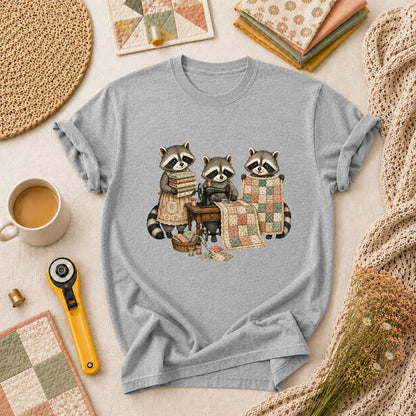 Three Raccoons Quilting Together Sewing Machine T-Shirt - Athletic Heather