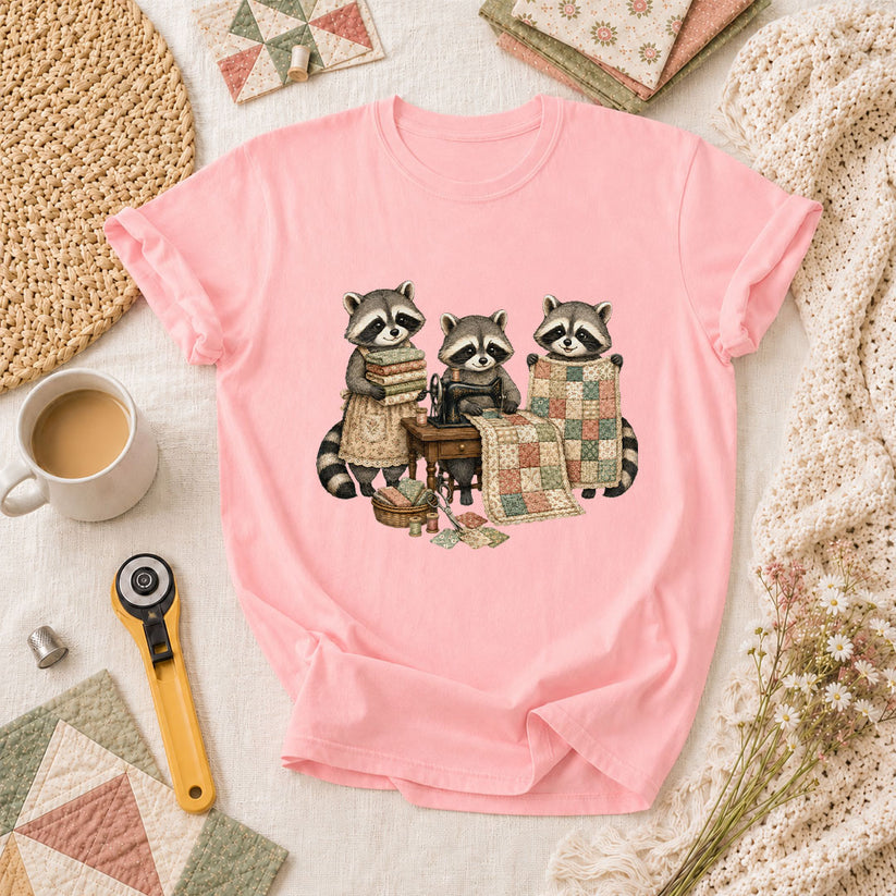Three Raccoons Quilting Together Sewing Machine T-Shirt - Pink
